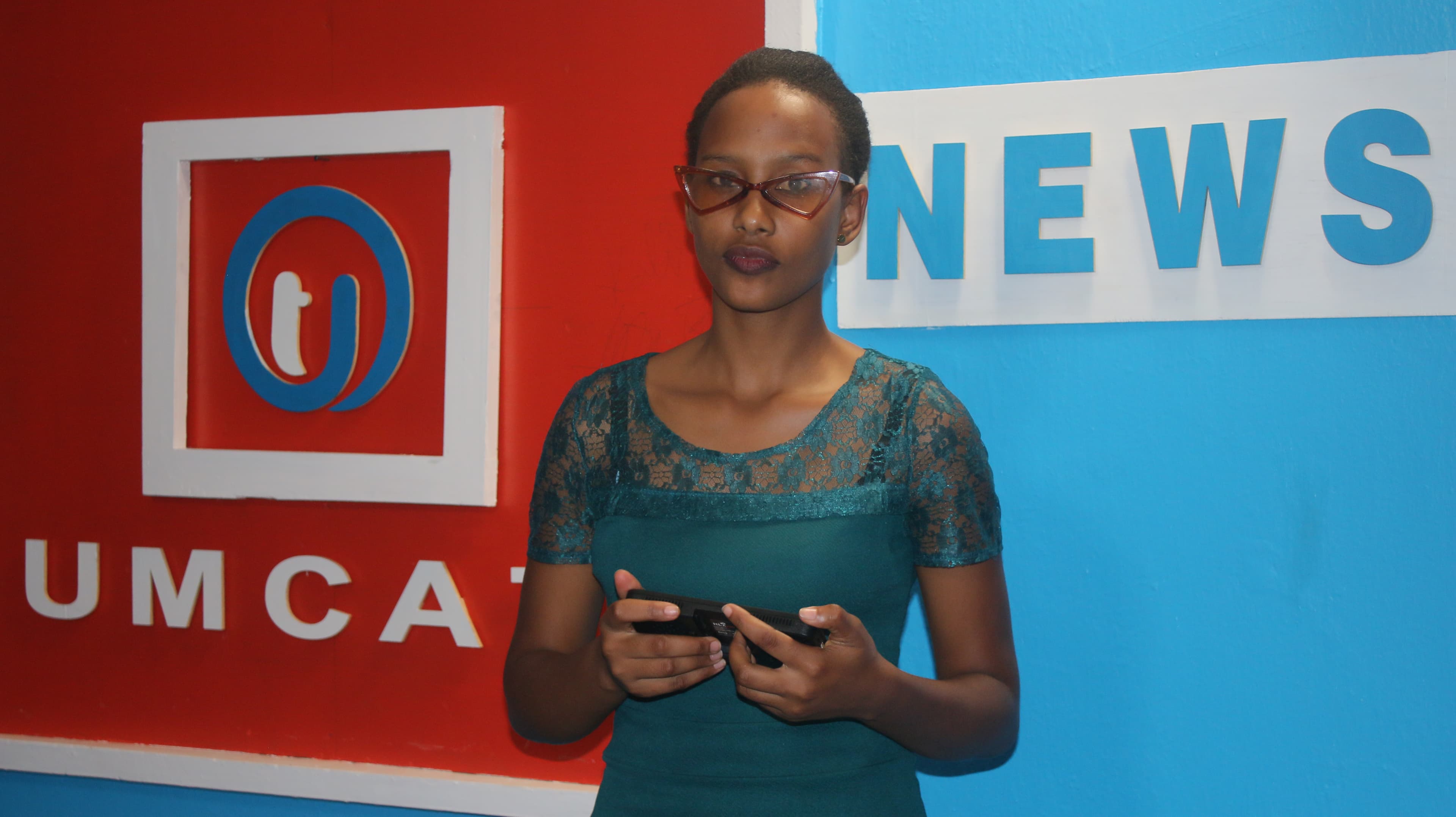 Student news anchor in the studio